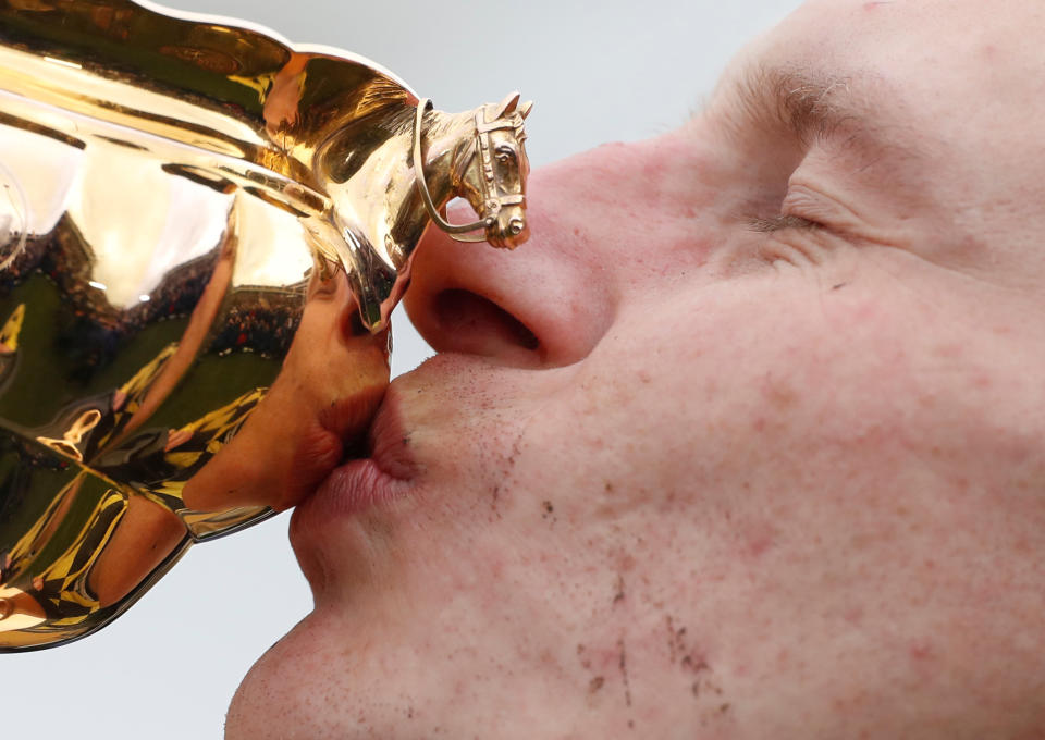 Paul Townend celebrates with the trophy after riding Al Boum Photo in Magners Cheltenham Gold Cup at the 2019 Festival