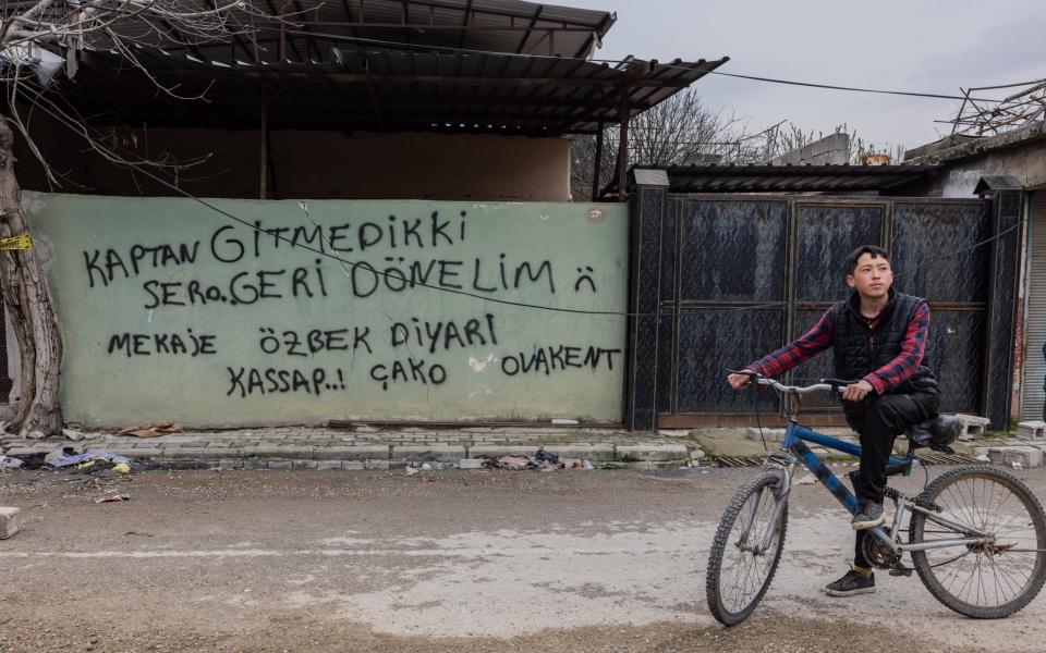 Graffiti in Ovakent, sprayed in Turkish on the wall, reads: ‘We didn't go, we are still here’ - Stefanie Glinski