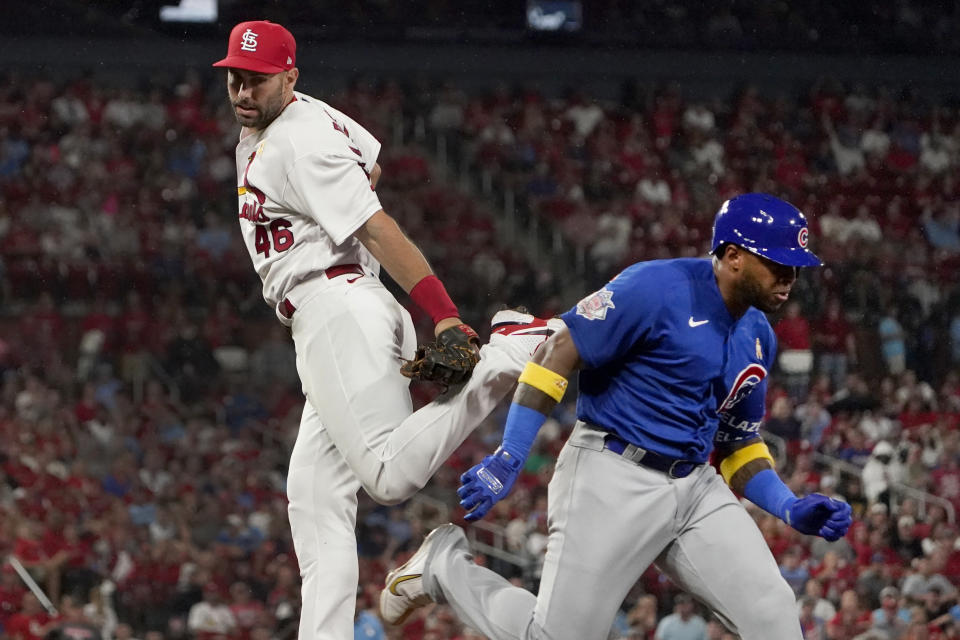 Chicago Cubs' Nelson Velazquez, right, is safe at first for a single as he avoids the tag from St. Louis Cardinals first baseman Paul Goldschmidt (46) during the fourth inning of a baseball game Friday, Sept. 2, 2022, in St. Louis. (AP Photo/Jeff Roberson)