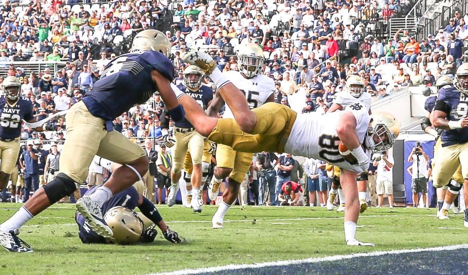 Notre Dame tight end Durham Smythe (80) dives across the goal line for a touchdown during second quarter NCAA football action against Navy at EverBank Field in Jacksonville, Fla., Saturday, Nov. 5, 2016. (For The Florida Times-Union/Gary McCullough)