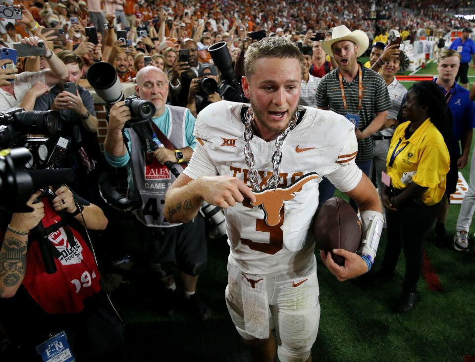 Texas quarterback Quinn Ewers celebrates the Longhorns' 34-24 win over Alabama on Saturday night at Bryant-Denny Stadium in Tuscaloosa. But later, in his postgame press conference, Ewers preached patience: “It’s still early, we’ve still got a lot of games left, a lot of games to play," he said.