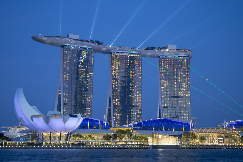 SINGAPORE - AUGUST 19: The Marina Bay Sands with The ArtScience Museum illuminated at night on August 19, 2019 in Singapore.  (Photo by Athanasios Gioumpasis/Getty Images)