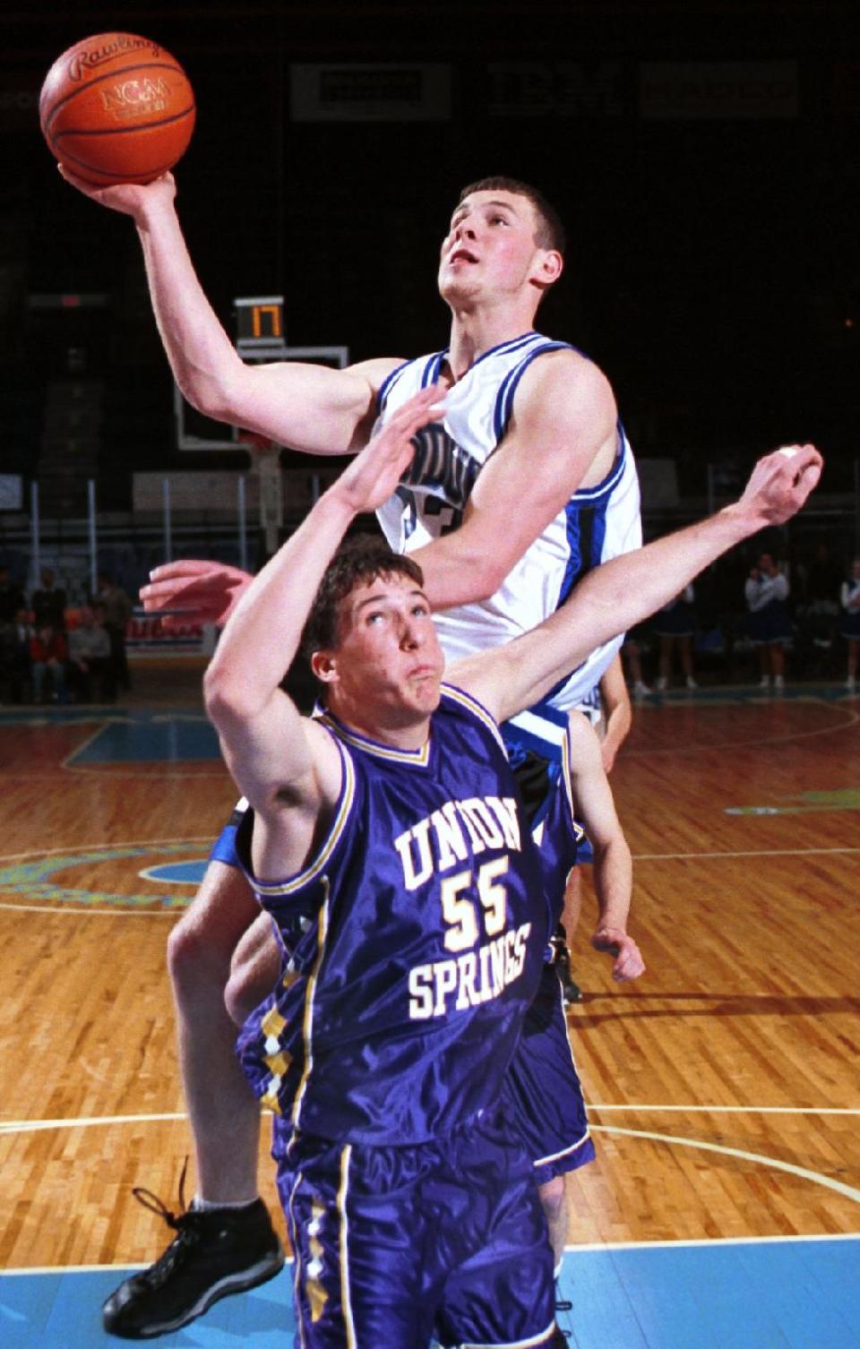 Candor's Toby Foster puts up a shot in the Section 4 Class C boys basketball title game in 1998.