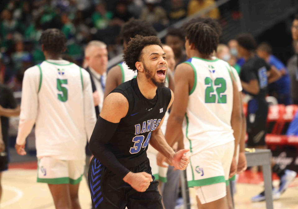 Woodward guard Paul McMillan IV celebrates after their win over  Chaminade Julienne in the district final, Wednesday, March 2, 2022.