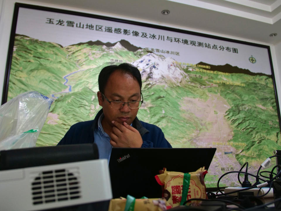 This Sept. 21, 2018 photo shows glaciologist Wang Shijin at the Chinese Academy of Science glacier station in Linjiang in the southern province of Yunnan in China. He and other researchers have tracked the Baishui Glacier No. 1, one of the world's fastest melting glaciers, rapidly shrink due to climate change and its relative proximity to the Equator. (AP Photo/Sam McNeil)