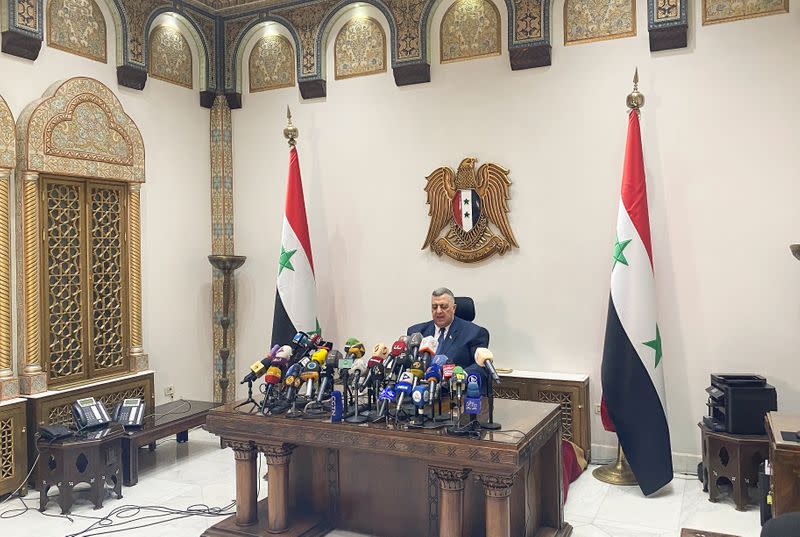 Parliament Speaker Hammouda Sabbagh announces the results of the Syrian presidential election at the Syrian parliament building in Damascus