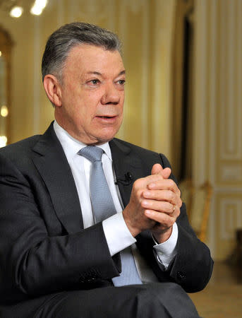 Colombia's outgoing President Juan Manuel Santos speaks with Reuters at the presidential palace, in Bogota, Colombia July 30, 2018. Picture taken July 30, 2018. REUTERS/Carlos Julio Martinez