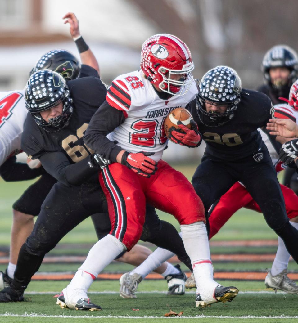 Lena-Winslow's Henry Engel makes a stop against Forreston's Johnathan Kobler on Saturday, Nov. 19, 2022, at Freeport High School in Freeport.