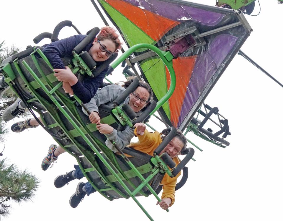 From left, Matthew, Karleen and Marie Desautell take a ride on the Cliff Hanger at Autumnfest in 2019.