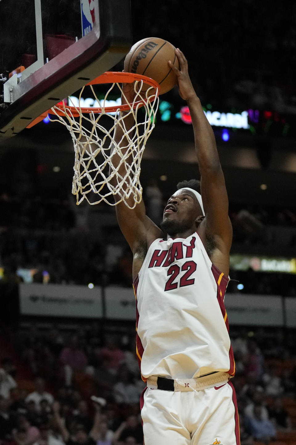 Miami Heat forward Jimmy Butler (22) dunks during the first half of an NBA basketball play-in tournament game against the Chicago Bulls, Friday, April 14, 2023, in Miami. (AP Photo/Rebecca Blackwell)