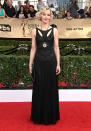 <p>Gretchen Mol accessorized her black dress with a statement pendant. (Photo: Getty Images) </p>