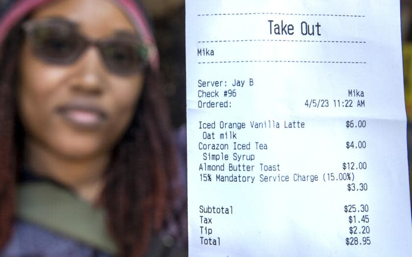 Meeka Smith, 43, visiting from Baltimore, Maryland, shows her receipt.