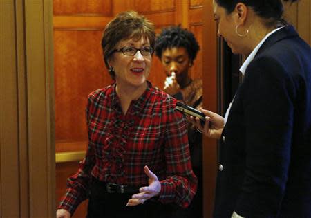 U.S. Senator Susan Collins (R-ME) talks to reporters after a Senate cloture vote on budget bill on Capitol Hill in Washington December 17, 2013. REUTERS/Yuri Gripas