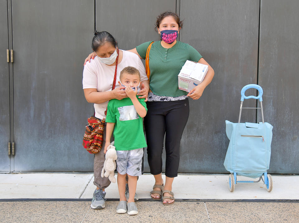 Maria and her family are one of many New Yorkers in need to receive free produce, dry goods, and meat at a Food Bank For New York City distribution event at Lincoln Center on July 29, 2020, in New York City. (Photo by Michael Loccisano/Getty Images for Food Bank For New York City)