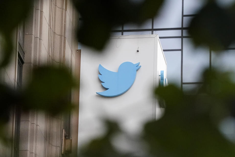 FILE - A sign at Twitter headquarters is shown in San Francisco, Dec. 8, 2022. San Francisco officials are investigating Twitter after six former employees allege that owner Elon Musk's leadership team broke laws in turning the company's headquarters into a “Twitter Hotel” for workers being pushed to stay up late to transform the social media platform. (AP Photo/Jeff Chiu, File)