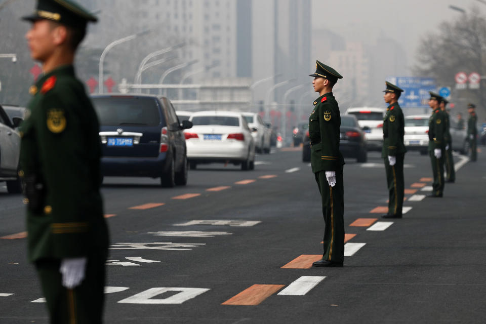 <p>Security personnel take position along Beijing’s main east-west thoroughfare, Changan Avenue, in Beijing, China, March 27, 2018. (Photo: Damir Sagolj/Reuters) </p>