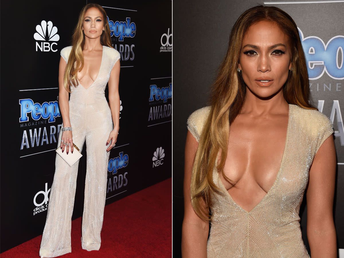 Jennifer Lopez proved she's Hollywood's golden girl when she stepped out in a jaw-dropping plunging jumpsuit at the PEOPLE Magazine Awards in Los Angeles. The diva, 45, dazzled in a glitzy Naeem Khan creation, while revealing her ample assets at the star-studded event that honors the top pop culture newsmakers of the year on Dec. 18, 2014.