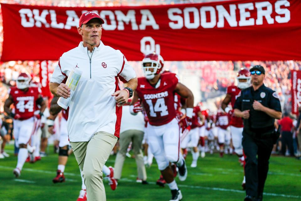 Brent Venables runs on the field before an NCAA football game between University of Oklahoma (OU) and Iowa State at the Gaylord Family Oklahoma Memorial Stadium in Norman, Okla., on Saturday, Sept. 30, 2023.