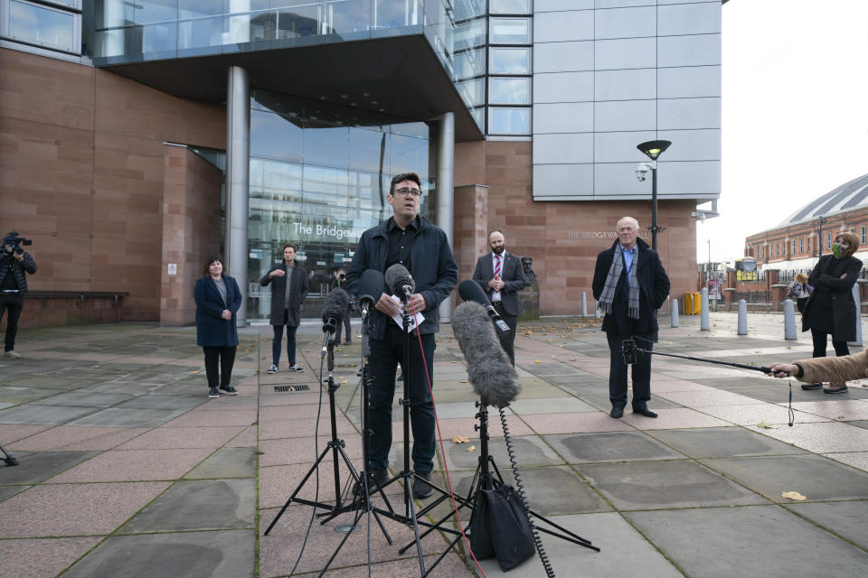 Greater Manchester mayor Andy Burnham speaks to the media outside Bridgewater Hall, following last-ditch talks with the Prime Minister aimed at securing additional financial support for his consent on new coronavirus restrictions, in Manchester, England, Tuesday, Oct. 20, 2020. The British government appeared poised Tuesday to impose strict coronavirus restrictions on England's second-largest city after talks with officials in Greater Manchester failed to reach an agreement on financial support for people whose livelihoods will be hit by the new measures (AP Photo/Jon Super)