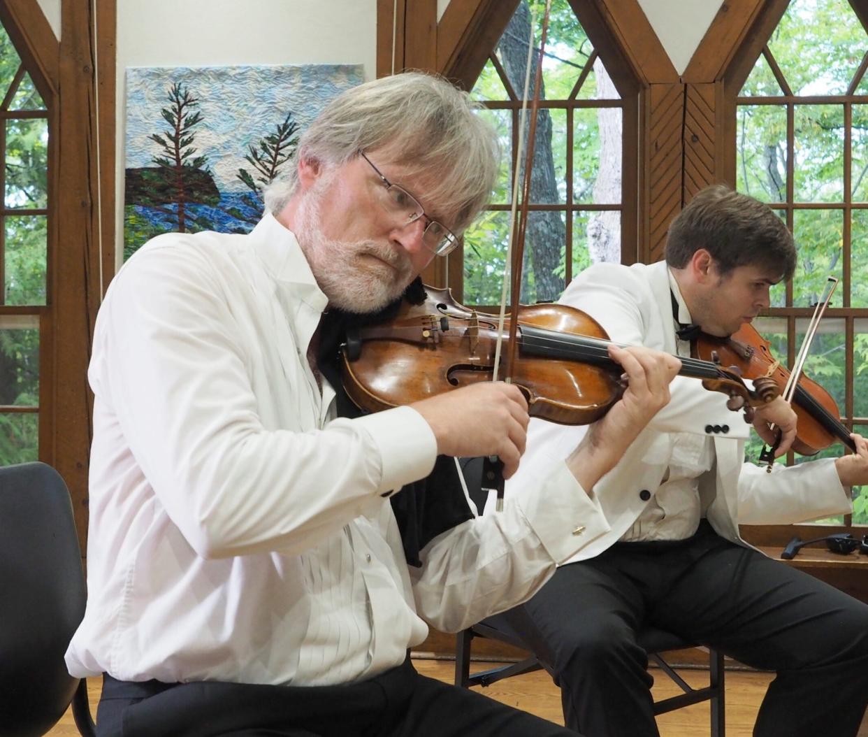 Violinist David Perry performs in a Midsummer's Music concert during its 2023 season, Perry is among the many professional musicians playing in Midsummer's 2024 season of 38 chamber music concerts.