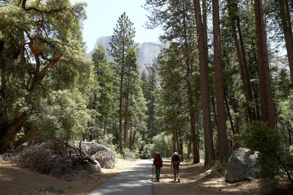 Yosemite national park visitors go backpacking on the park’s first day of reopening after being closed for coronavirus restrictions.