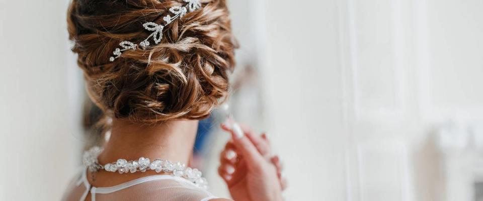 Bridal wedding hairstyle with jewelry wreath