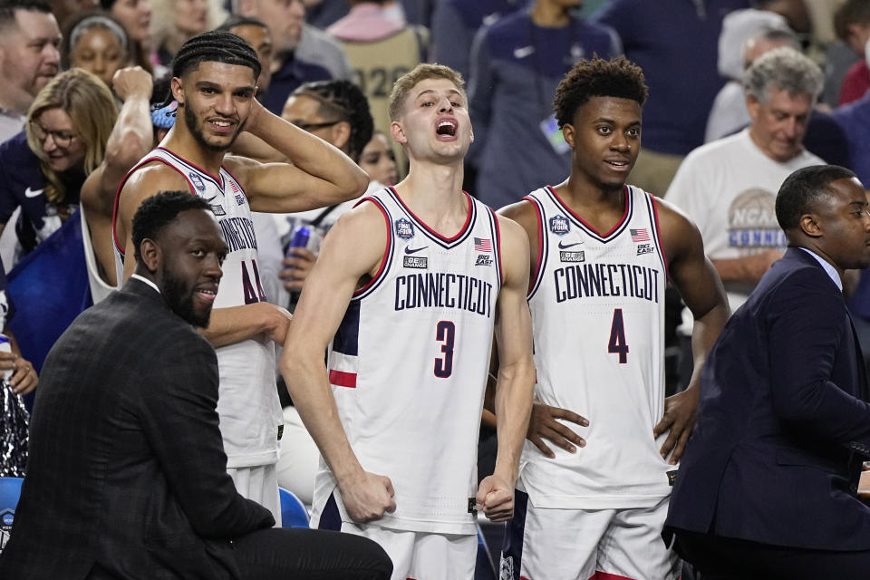 Connecticut guard Joey Calcaterra (3) celebrates after their win against Miami in a Final Four college basketball game in the NCAA Tournament on Saturday, April 1, 2023, in Houston. (AP Photo/Brynn Anderson)