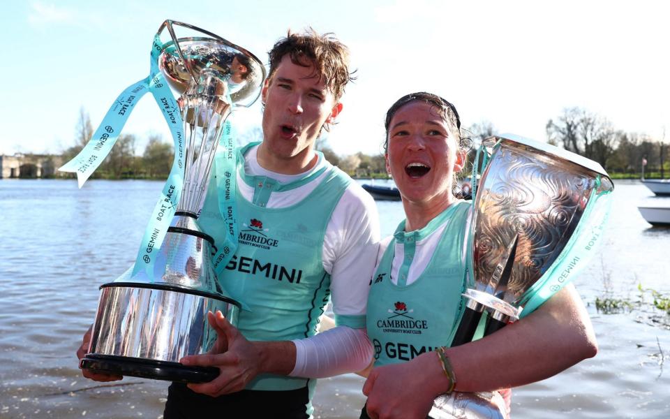 Cambridge's Augustus John and Jenna Armstrong celebrate with the trophies after winning the men's and women's races
