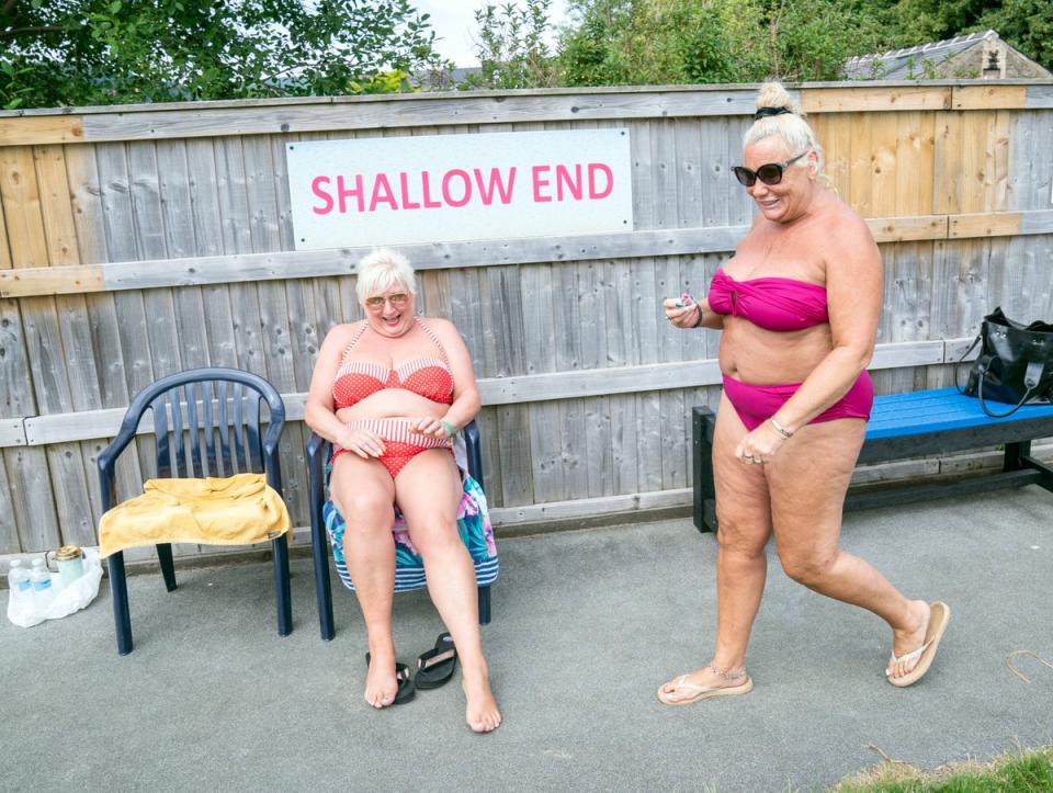 People enjoy the hot weather at Hathersage open air swimming pool at Hope Valley, near Sheffield (PA)