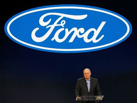 Jim Hackett (L), President and CEO of Ford Motor Company, speaks at the Ford press preview at the North American International Auto Show in Detroit, Michigan, U.S., January 14, 2018. REUTERS/Brendan Mcdermid