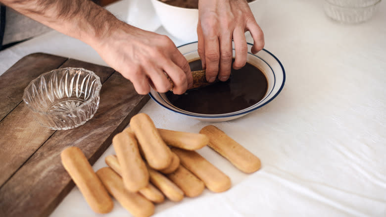 Dipping ladyfingers in espresso