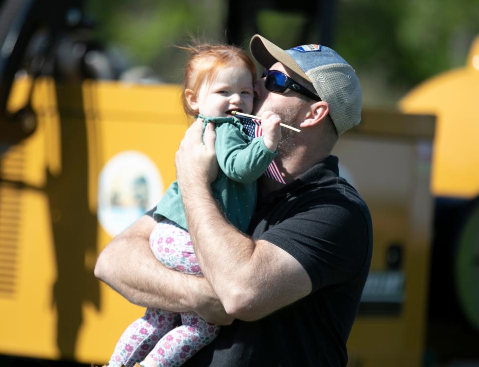 Matt Benge and his daughter Ryleigh share a moment during Marion County Day at the McPherson Governmental Complex in Ocala on  March 26, 2022.