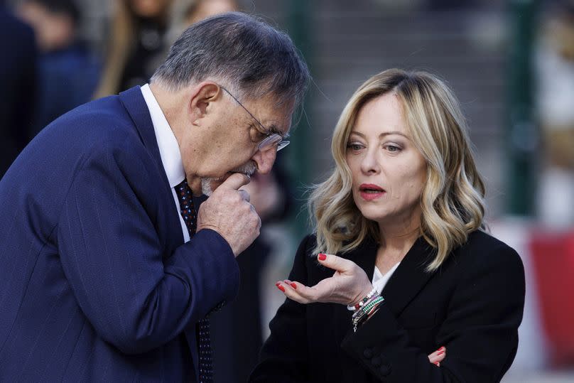 Italy's Prime Minister Giorgia Meloni talks with President of the Senate Ignazio La Russa at the Altar of the Fatherland for the 79th anniversary of the Liberation Day