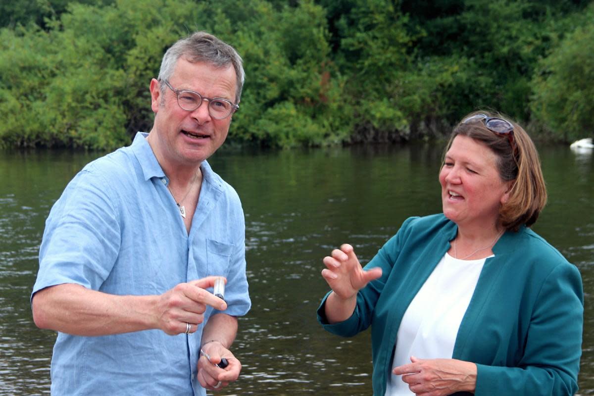 TV personality, writer and chef Hugh Fearnley-Whittingstall tests pollution levels in the river Wye with Green Party candidate Ellie Chowns <i>(Image: LDRS)</i>