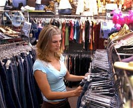 Ashley Fugate of Paoli cruises through a rack of jeans at Plato's Closet during a recent trip to Bloomington. The store specializes in fashion-oriented used youth clothing. David Snodgress | Herald-Times