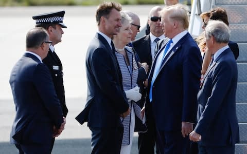 President Donald Trump is greeted by Jeremy Hunt at Stansted - Credit: Luke MacGregor/Bloomberg