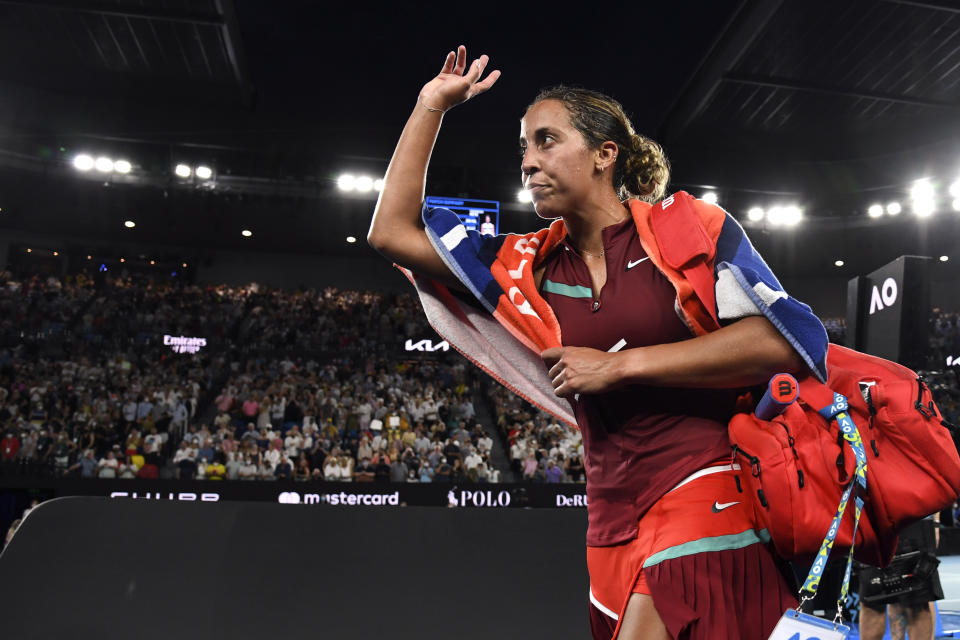 Madison Keys of the U.S. waves as she leaves Rod Laver Arena after her semifinal loss to Ash Barty of Australia at the Australian Open tennis championships in Melbourne, Australia, Thursday, Jan. 27, 2022. (AP Photo/Andy Brownbill)