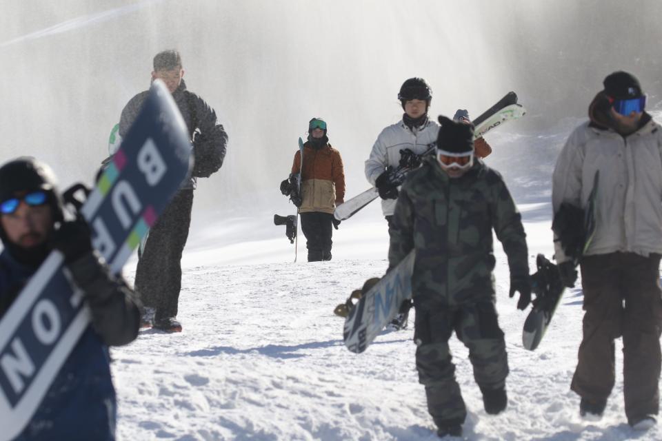 Skiers and snowboarders brave the cold and head down the slopes at Mountain Creek Resort in Vernon, NJ. Mountain Creek Resort is open and making snow here on January 4, 2022.