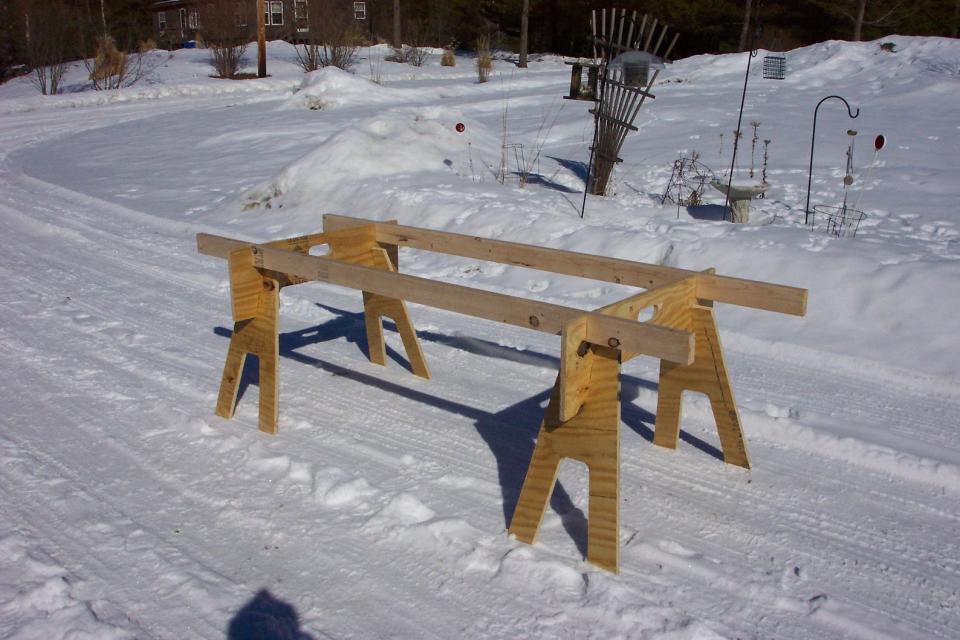 knock-down sawhorse on snowy yard