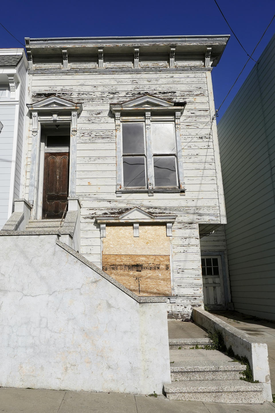 A recently sold Victorian home is shown in San Francisco, Friday, Jan. 14, 2022. The decaying, 122-year-old Victorian marketed as "the worst house on the best block" of San Francisco recently sold for nearly $2 million — an eye-catching price that the realtor said was the outcome of overbidding in an auction. (AP Photo/Jeff Chiu)