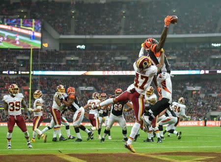 Oct 30, 2016; London, United Kingdom; Washington Redskins cornerback Quinton Dunbar (47) is penalized for pass interference against Cincinnati Bengals wide receiver Brandon LaFell (11) at Wembley Stadium. Mandatory Credit: Steve Flynn-USA TODAY Sports