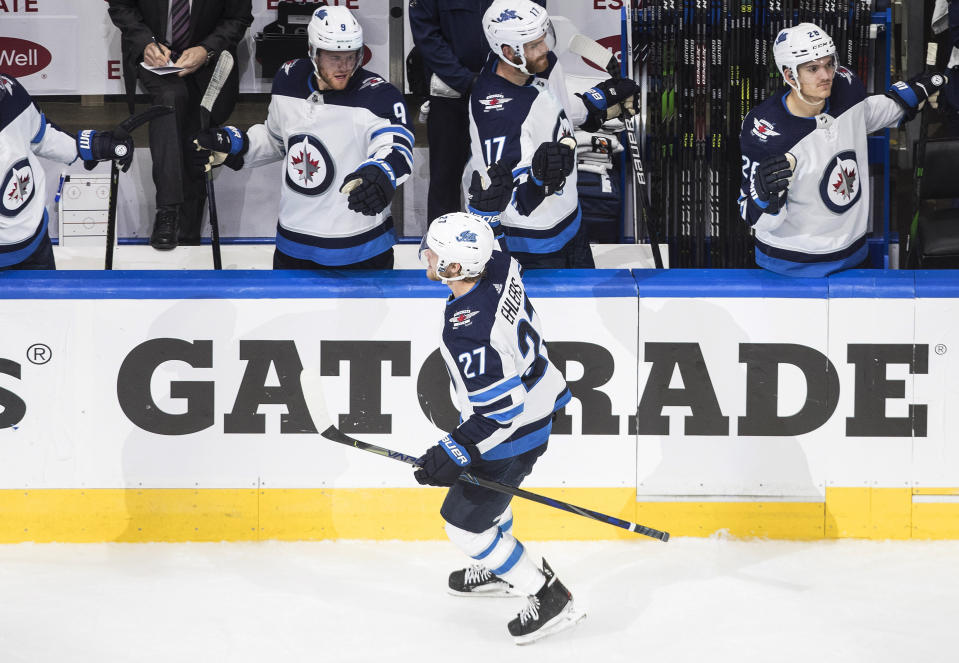 Winnipeg Jets' Nikolaj Ehlers (27) celebrate a goal against the Calgary Flames during the third period of an NHL hockey playoff game Monday, Aug. 3, 2020 in Edmonton, Alberta. (Jason Franson/The Canadian Press via AP)