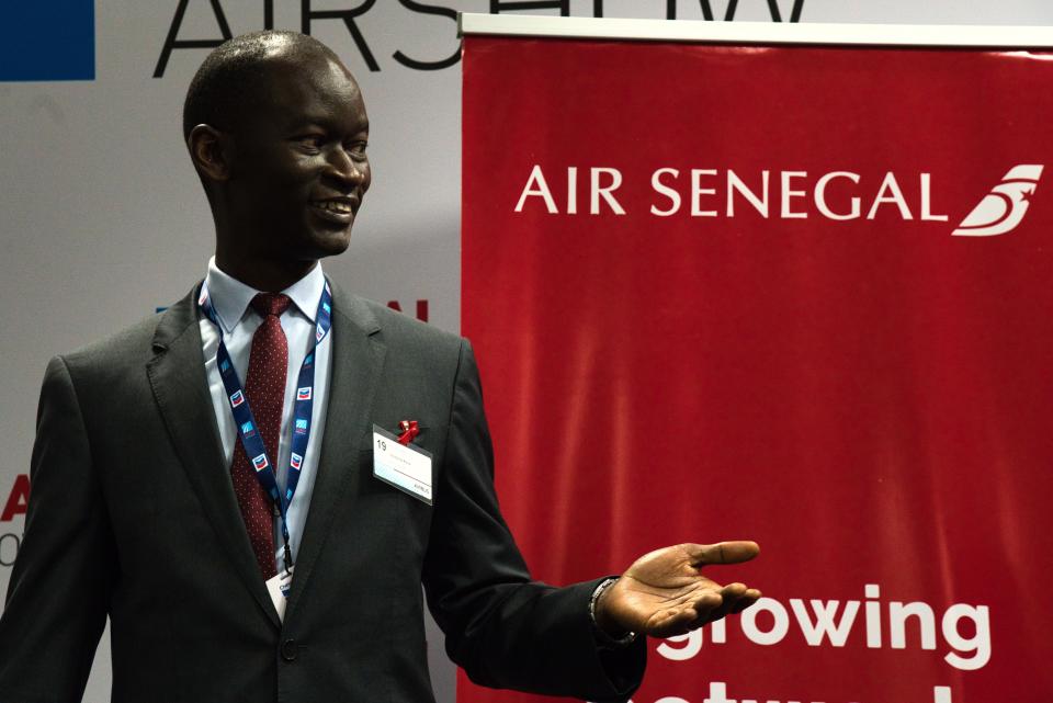 Air Senegal CEO Ibrahima Kane gestures before the start of a news conference at the Dubai Airshow in Dubai, United Arab Emirates, Tuesday, Nov. 19, 2019. Air Senegal said Tuesday it will purchase eight Airbus A220 aircraft. (AP Photo/Jon Gambrell)