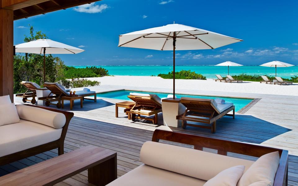 The pool deck in a Two-Bedroom Beach House