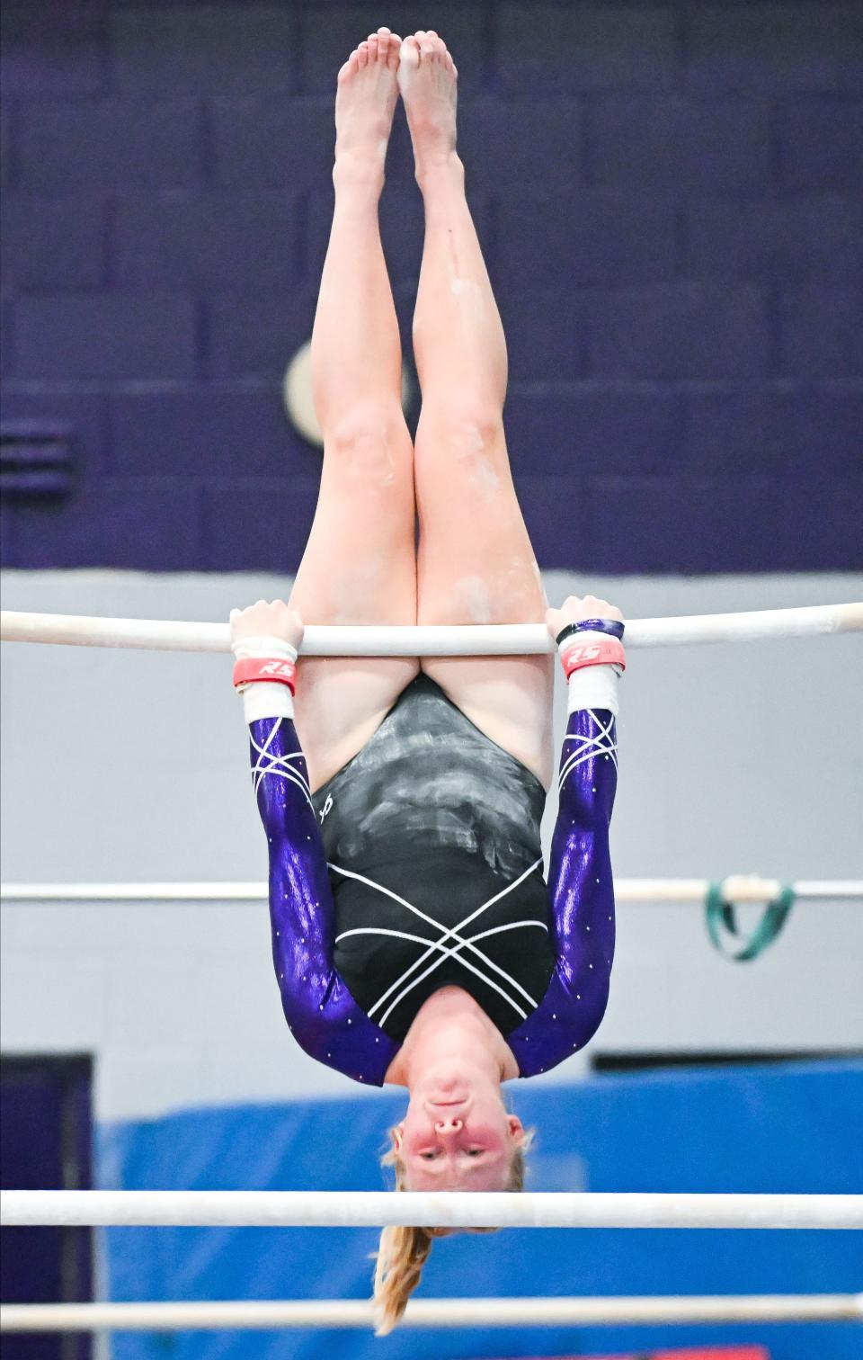Bloomington South’s Morgan Cockerill competes on the bars during the gymnastics meet against Bloomington North and Edgewood at South on Monday, Jan. 8, 2024.