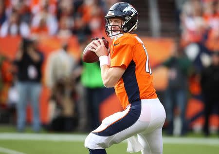 Nov 15, 2015; Denver, CO, USA; Denver Broncos quarterback Peyton Manning (18) prepares to throw the ball during the first half against the Kansas City Chiefs at Sports Authority Field at Mile High. Mandatory Credit: Chris Humphreys-USA TODAY Sports