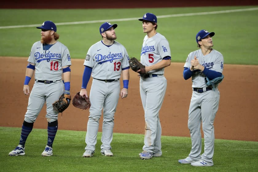 Arlington, Texas, Sunday, October 25, 2020 Dodgers infielders meet near the mound during a pitching change in game five of the World Series at Globe Life Field. Left to right are Justin Turner, Max Muncy, Corey Seager and Kike Martinez. (Robert Gauthier/ Los Angeles Times)