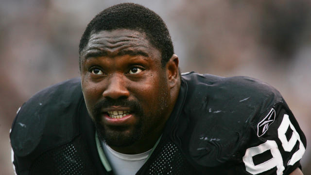 Oakland Raiders' Warren Sapp, #99, is all smiles after causing a