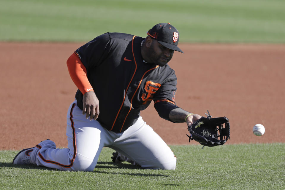 San Francisco Giants' Pablo Sandoval fields a ground ball during spring training baseball practice, Tuesday, Feb. 18, 2020, in Scottsdale, Ariz. (AP Photo/Darron Cummings)