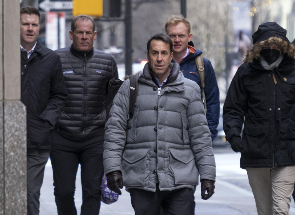 Major League Baseball deputy commissioner Dan Halem, center, arrives for a meeting in New York, Monday, Jan. 24, 2022, for the first in-person baseball negotiating session since the MLB lockout began. At far left is Patrick Houlihan, Senior Vice President & Deputy General Counsel, Labor Relations at Major League Baseball, second from left is Colorado Rockies owner Dick Montfort, and behind Halem is executive vice president Morgan Sword. (AP Photo/Craig Ruttle)